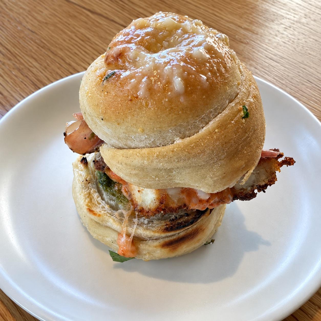Chicken pesto garlic knot slider with provolone and spicy vodka sauce