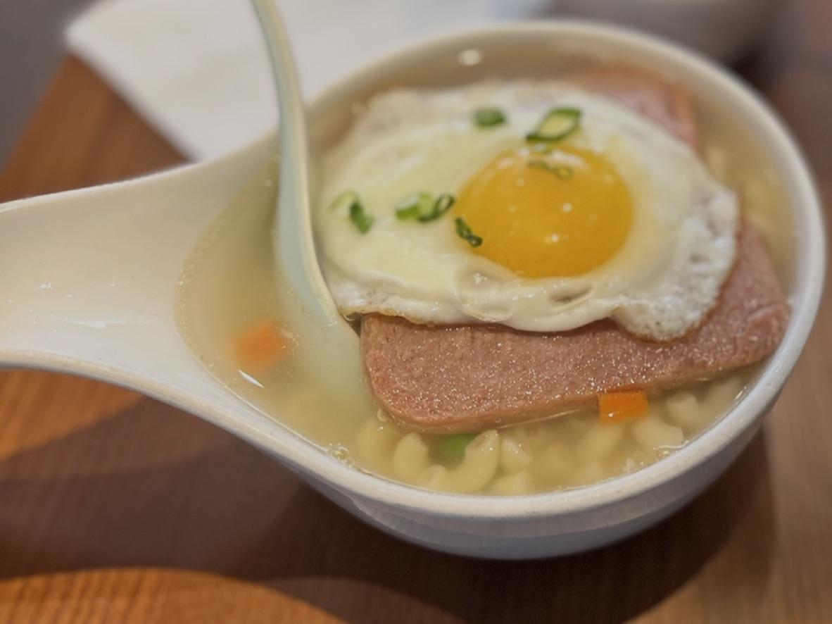 Hong Kong-style macaroni soup topped with luncheon meat, a fried egg, and scallions